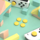 eXtremeRate PlayVital Switch Joystick Caps, Switch Lite Thumbstick Caps, Silicone Analog Cover for Switch OLED Joycon Thumb Grip Rocker Caps for Nintendo Switch & Switch Lite - Bright Yellow - NJM1192